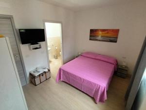 Postel nebo postele na pokoji v ubytování La Fenice + 11 fotografií