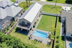an aerial view of a house with a swimming pool at Athenas Cottage in Butler Beach