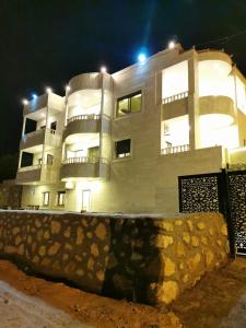 a large white building with lights on top of it at Quiet stay in Jerash