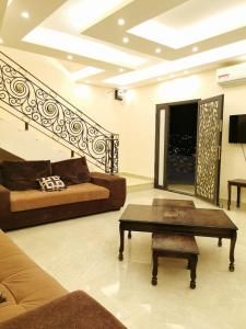 a living room with a couch and a coffee table at Quiet stay in Jerash