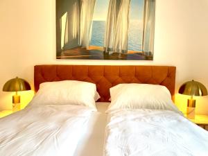 Postel nebo postele na pokoji v ubytování Exploria Apartments