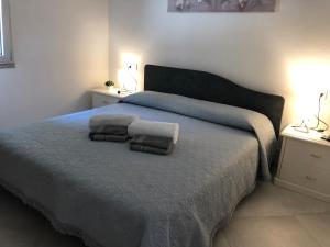 A bed or beds in a room at Giorgia&Greta- relax casa vacanze