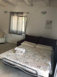 A bed or beds in a room at Giorgia&Greta- relax casa vacanze