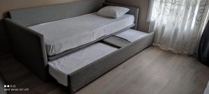 a small bedroom with a bed and a window at Cosy Apartment Disneyland'Val d'Europe'Paris in Serris +12 photos