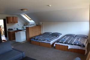 Postel nebo postele na pokoji v ubytování Stanislava Pechová Apartmán HakElaKuky
