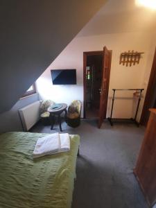 Posteľ alebo postele v izbe v ubytovaní POKOJE RODIS