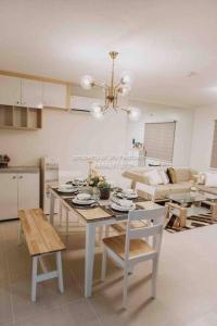 a kitchen and dining room with a table and chairs at Work-friendly Mountain-view condo near SM Seaside in Cebu City