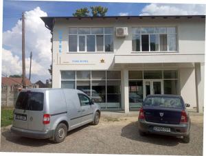 a white van parked in front of a building at PARK-hotel in Cahul