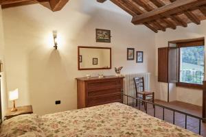 Ένα ή περισσότερα κρεβάτια σε δωμάτιο στο Agriturismo Il Casalino