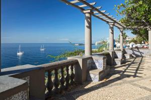 a row of stone stairs next to the ocean at Lazareto Mar by An Island Apart in Funchal