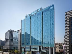 a large glass building with a lot of windows at Shilla Stay Gangnam Yeoksam in Seoul