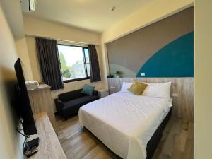 Ένα ή περισσότερα κρεβάτια σε δωμάτιο στο Liu Shi Guang BnB