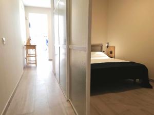 A bed or beds in a room at Mazi Apartments Chic