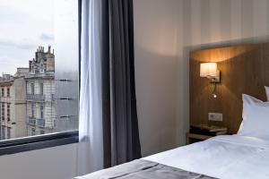 Katil atau katil-katil dalam bilik di Hôtel Le Père Léon