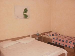 Postel nebo postele na pokoji v ubytování Apartments & Rooms Tony