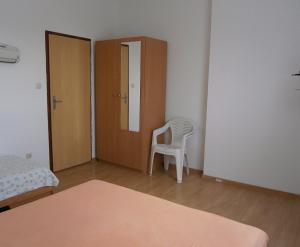 Postel nebo postele na pokoji v ubytování Apartments & Rooms Tony