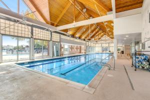 a large indoor pool with a large swimming pool at Bear Trap Dunes - 58D October Glory in Ocean View