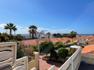 a view from the balcony of a resort with palm trees at La Marieta in Callao Salvaje