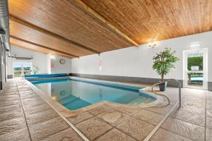 a swimming pool in the middle of a building at House Martin in Ipplepen