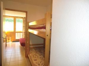 a room with two bunk beds in a room at Appartement La Plagne Montalbert , 2 pièces, 5 personnes - FR-1-181-2463 in Aime-La Plagne