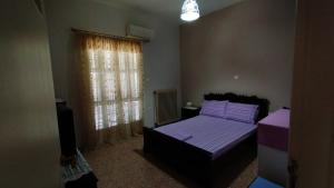 A bed or beds in a room at Anastasia's House near Kalamata