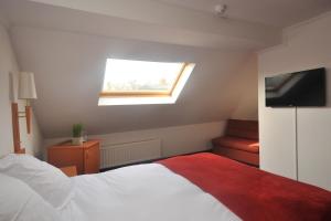 Letto o letti in una camera di Hôtel du Perron