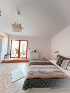 Postel nebo postele na pokoji v ubytování Apartmán NIKLAN
