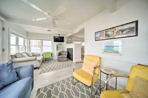 a living room with a couch and chairs at Sunny, Modern Waterfront Cottage with Grill in Erie! in Erie