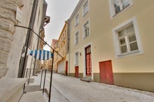 an empty street in an alley with buildings at Luxury Suites - Old Town Sauna Str in Tallinn