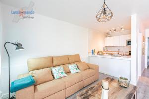 a living room with a couch and a table at Vivienda Vacacional Casa Evy in Puerto del Carmen