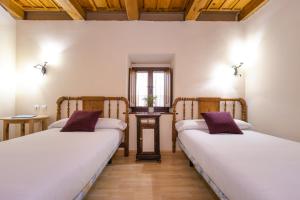 Postel nebo postele na pokoji v ubytování Casa Fuente del Val