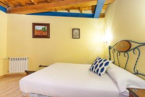 Postel nebo postele na pokoji v ubytování Casa Fuente del Val