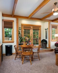 a dining room with a table and chairs and a fireplace at Adventures From Bozeman's Perfect Location in Bozeman