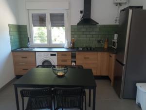 Kuchyň nebo kuchyňský kout v ubytování Acogedora casa de invitados