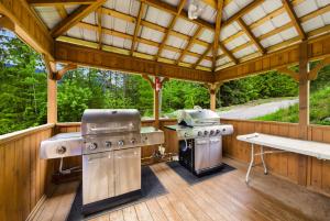 a large outdoor kitchen with two burners and a grill at Kootenay Lakeview Resort BW Signature Collection in Balfour