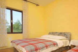 Postel nebo postele na pokoji v ubytování Apartments by the sea Starigrad, Paklenica - 6623