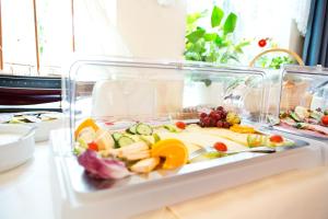 a clear container filled with food on a table at Zum Goldenen Anker in Tönning