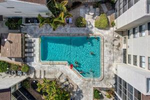 an overhead view of a swimming pool between two buildings at Bay Oaks 75 in Siesta Key