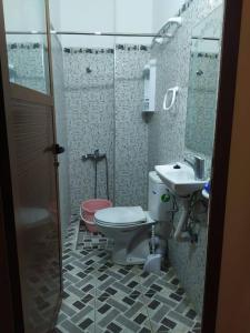 a bathroom with a toilet and a sink at Dar hanae tanger in Tangier