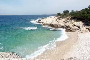 a view of the ocean and a rocky beach at Rooms with a parking space Premantura, Medulin - 7463 in Medulin