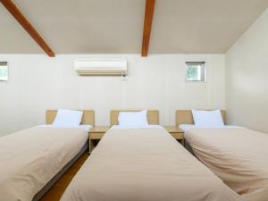 Postelja oz. postelje v sobi nastanitve Tabist Villa Daio Resort Ise-Shima