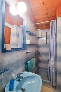 a bathroom with a sink and a shower at Apartments and rooms by the sea Vrboska (Hvar) - 540 in Vrboska