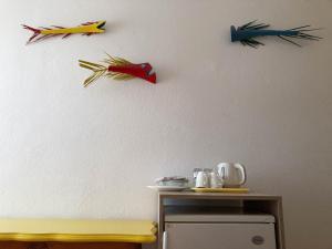 three origami birds on a wall above a table at Triple Room Vrboska 540d in Vrboska