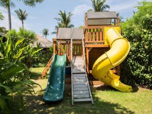 a playground with a slide and a slideintend at Villa Waimarie - SHA Extra Plus in Lipa Noi