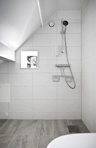 a bathroom with a shower with a shower head at A Place To Stay Stavanger, apartment 3 in Stavanger