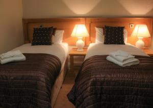 Llit o llits en una habitació de Murphys Hotel