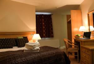 Postel nebo postele na pokoji v ubytování Murphys Hotel