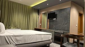 Postel nebo postele na pokoji v ubytování Hotel Emka + 29 fotografií
