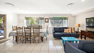 a living room with a couch and a table at My Shell Boat Harbour 55 Blanch Steet in Boat Harbour