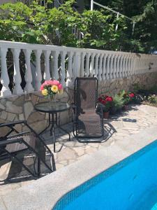 a patio with a table and chairs next to a pool at Imperia in Bar